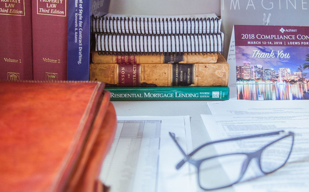 Image of books on a desk.